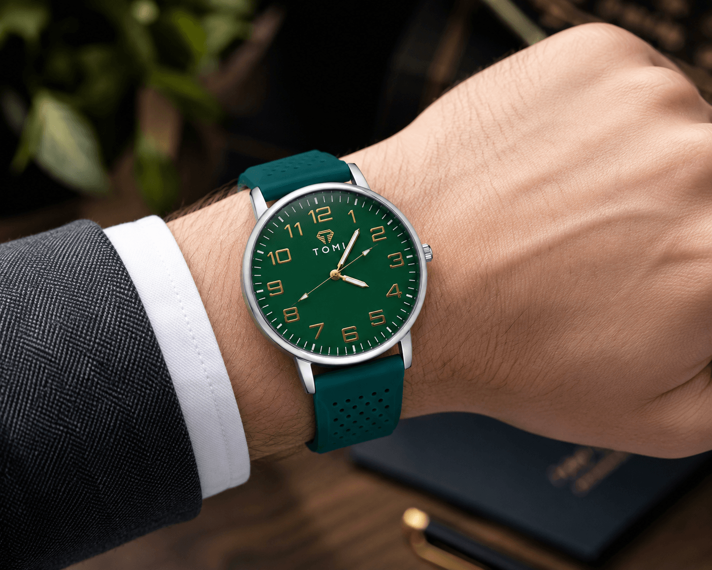 TOMI Verdeon watch styled against a green natural backdrop